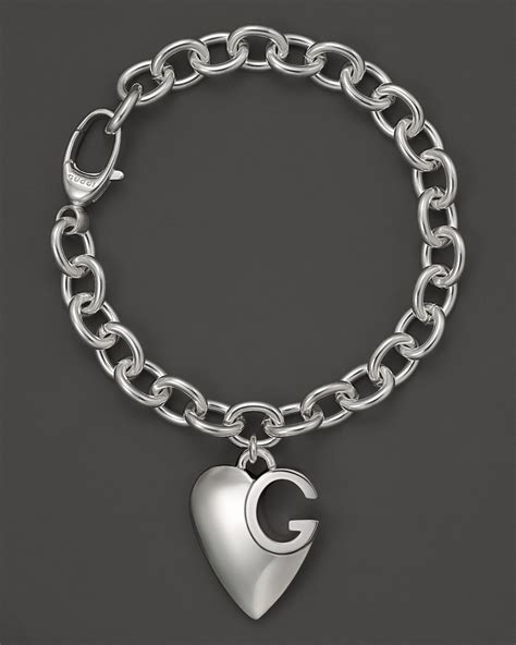 gucci silver charm bracelets|heart bracelet with gucci trademark.